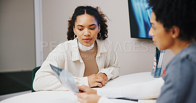 Buy stock photo Doctor, woman and talking to patient with x ray for medical results or advice in healthcare consultation. Clinic, person and radiology scan with paperwork or document for diagnosis or feedback