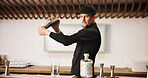 Cocktail, cafe and bartender man with shaker, glass and tools for artisan beverage recipe. Mixology, small business pub and barman at gin bar counter with happy hour drinks, process and craft alcohol
