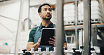 Distillery, tablet and man in factory thinking for alcohol production, manufacturing or distribution. Brewery, industrial inspection and person on tech for fermentation, quality control and storage