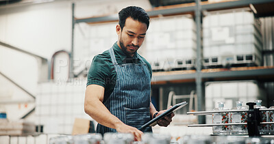 Buy stock photo Distillery, bottle and tablet with man in factory for packaging, assembly line and inspection checklist. Manufacturing, inventory and distribution with person in warehouse for quality control