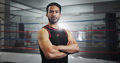 Buy stock photo Arms crossed, boxer and portrait of man in gym for mma fighter, workout and training practice. Wresting challenge, martial arts club and sports with person and boxing ring for exercise and battle
