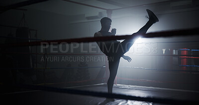 Buy stock photo Person, silhouette and kickboxing ring at gym, training or power with routine for combat sports. Athlete, fighter and mixed martial arts with workout, exercise or kick for contest at fitness club