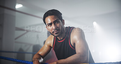 Buy stock photo Man, boxer and sweating with thinking in gym, intense and recovery with mindset for self defense exercise. Serious, fatigue and rest with exhausted male athlete, fitness and endurance in boxing ring