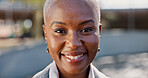 Portrait, business and black woman with smile in city for corporate career, viewing and real estate. Closeup, female realtor and happy for infrastructure, urban development and expansion opportunity