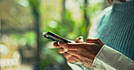 Hands, business and person typing with phone in office for communication, research and sustainable consultant. Advisor, mobile and online with schedule update, reading information and green project