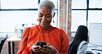Creative agency, businesswoman and smile with smartphone for chat, online news and contact in office. Workplace, female person and designer on break with digital, blog application and social media