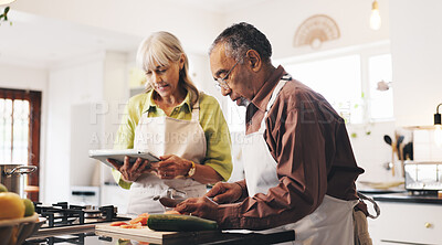 Buy stock photo Tablet, cooking and mature couple in kitchen in home with recipe for dinner, meal or dish. Digital technology, ingredients and man with woman for preparing supper with food tutorial together in house