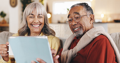 Buy stock photo Home, tablet and old couple on sofa, smile and conversation with retirement, love or internet. People, marriage or mature man with elderly woman, tech or entertainment with social media or connection