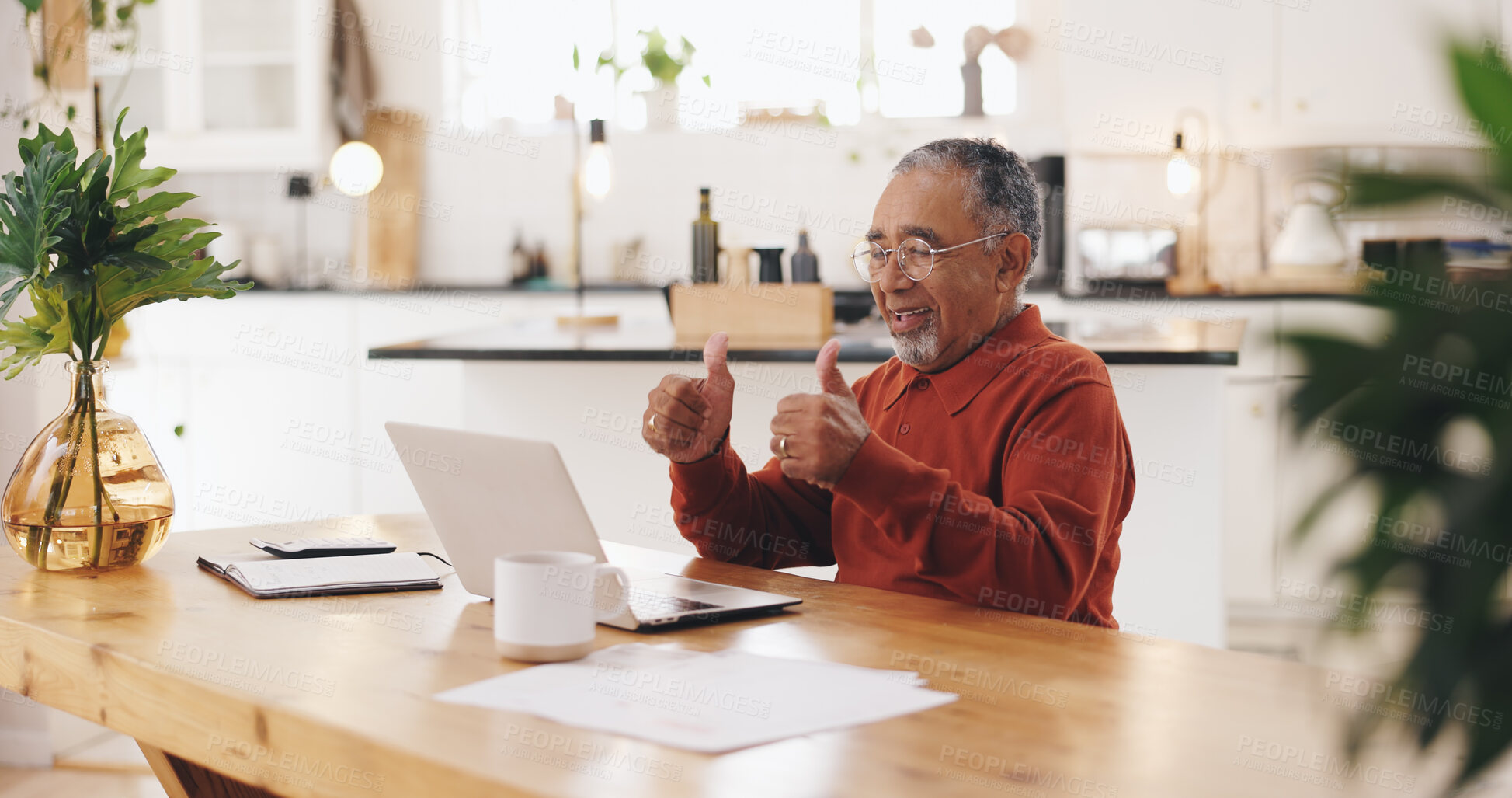 Buy stock photo Elderly man, laptop and thumbs up for video call in kitchen for tax, documents or smile for pension. Senior person, computer and sign for financial advisor with yes, deal and retirement plan in home
