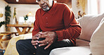 Mature man, knee pain and arthritis on couch in home, massage leg and joint problem with gout. Hands, senior person and bone inflammation with rheumatism, crisis and living room with strain injury