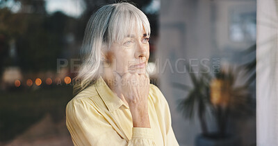 Buy stock photo Depression, window and thinking with senior woman in retirement home for loss, memories or nostalgia. Lonely, sadness and waiting with unhappy person in apartment for anxiety, dementia or stress