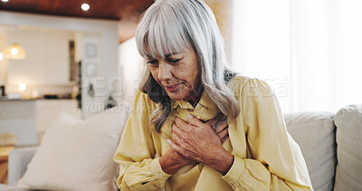 Buy stock photo Heart attack, chest pain and stress with old woman on sofa for hypertension, medical emergency and sick. Anxiety, health risk and cardiac arrest with senior person at home for high blood pressure