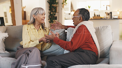 Buy stock photo Senior couple, talk and relax on sofa in home with smile, listening and discussion in living room. Elderly people, man and woman with chat, conversation and bonding with love in retirement at house