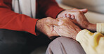 Holding hands, senior couple and comfort in home with care, love and prayer for faith in retirement. People, connection and support with bonding, trust and loyalty with relationship at apartment