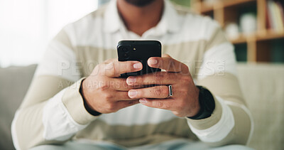 Buy stock photo Man, hands and relax with phone on sofa for app download, playing online game or streaming subscription. Closeup, scroll or person with smartphone in home for social media, dating site or mobile chat