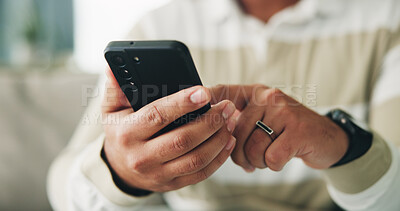 Buy stock photo Man, hands and scroll with phone on sofa for app download, playing online game and streaming service. Closeup, relax and person with smartphone in home for social media, reading ebook or dating site