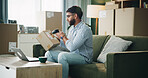 Home, small business and man with box, scanner and machine for label and address. Laptop, entrepreneur and person in apartment with package, stock or barcode for inventory management or dropshipping