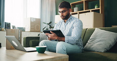 Buy stock photo Home, man and typing on tablet for logistics, distribution and remote work for customer service. Sofa, male person and business owner with digital for ecommerce, inventory management and supply chain