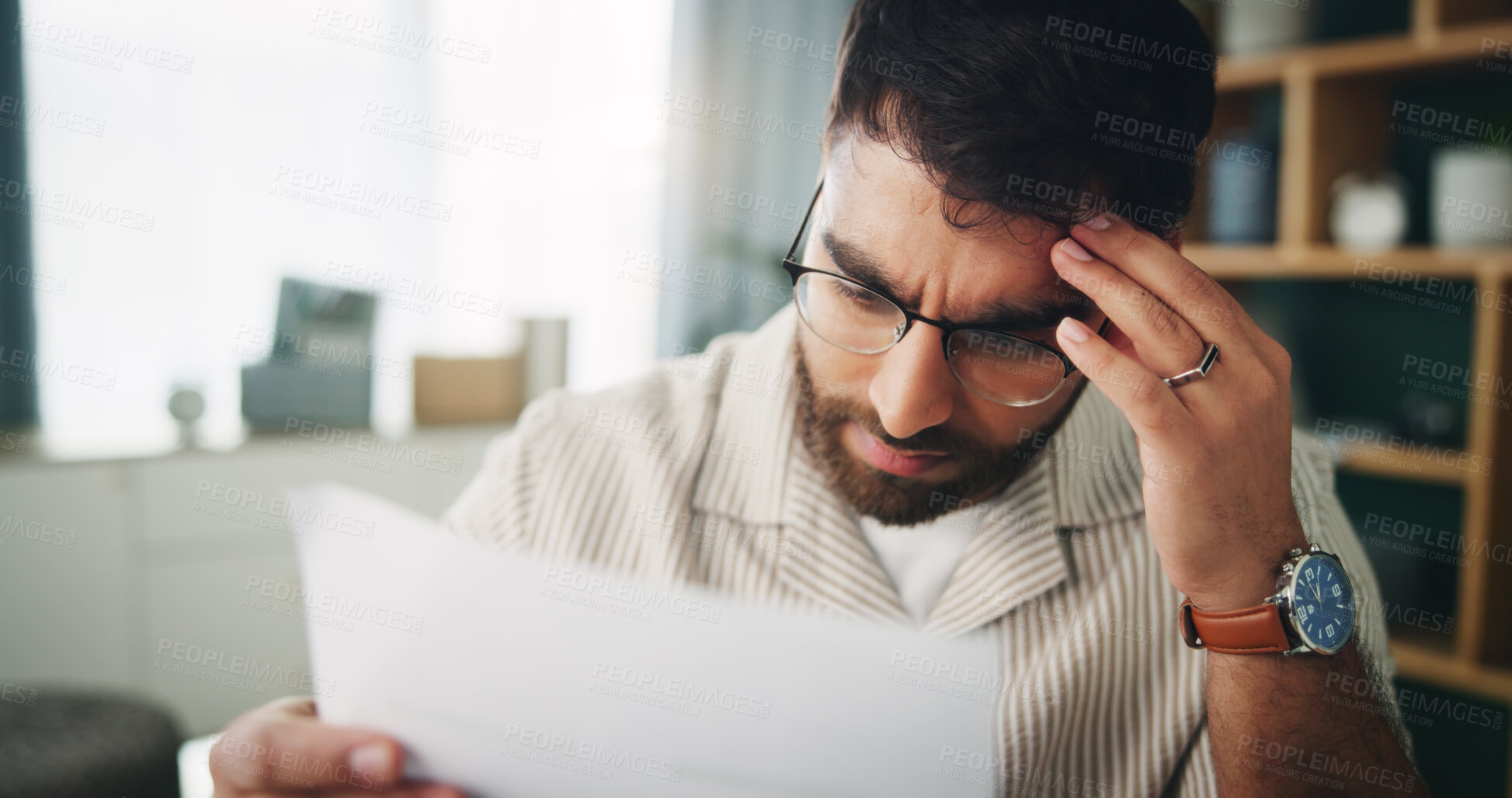 Buy stock photo Remote work, man and stress in home with paper, reading and finance crisis in startup. Entrepreneur, mental health and headache in living room with invoice error, document and upset for business debt
