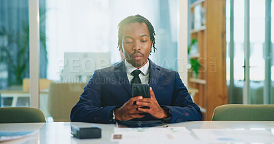 Buy stock photo Phone, business and serious black man in office to check email, message or investment banking. Mobile, worker and reading report online for financial news, economy or update on internet with chat app