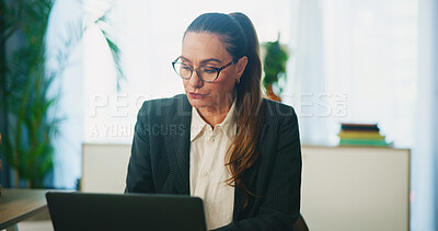Buy stock photo Laptop, mature and business woman in office to check email, revenue and accounting budget. Computer, serious worker and reading research for financial info, bookkeeping and payroll report for audit