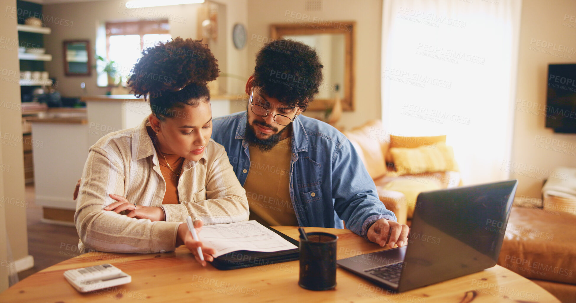 Buy stock photo Home, couple and laptop with paperwork for finance, track expenses and planning for budget goals. House, woman and man with documents for payment review, digital savings and mortgage bills with pen