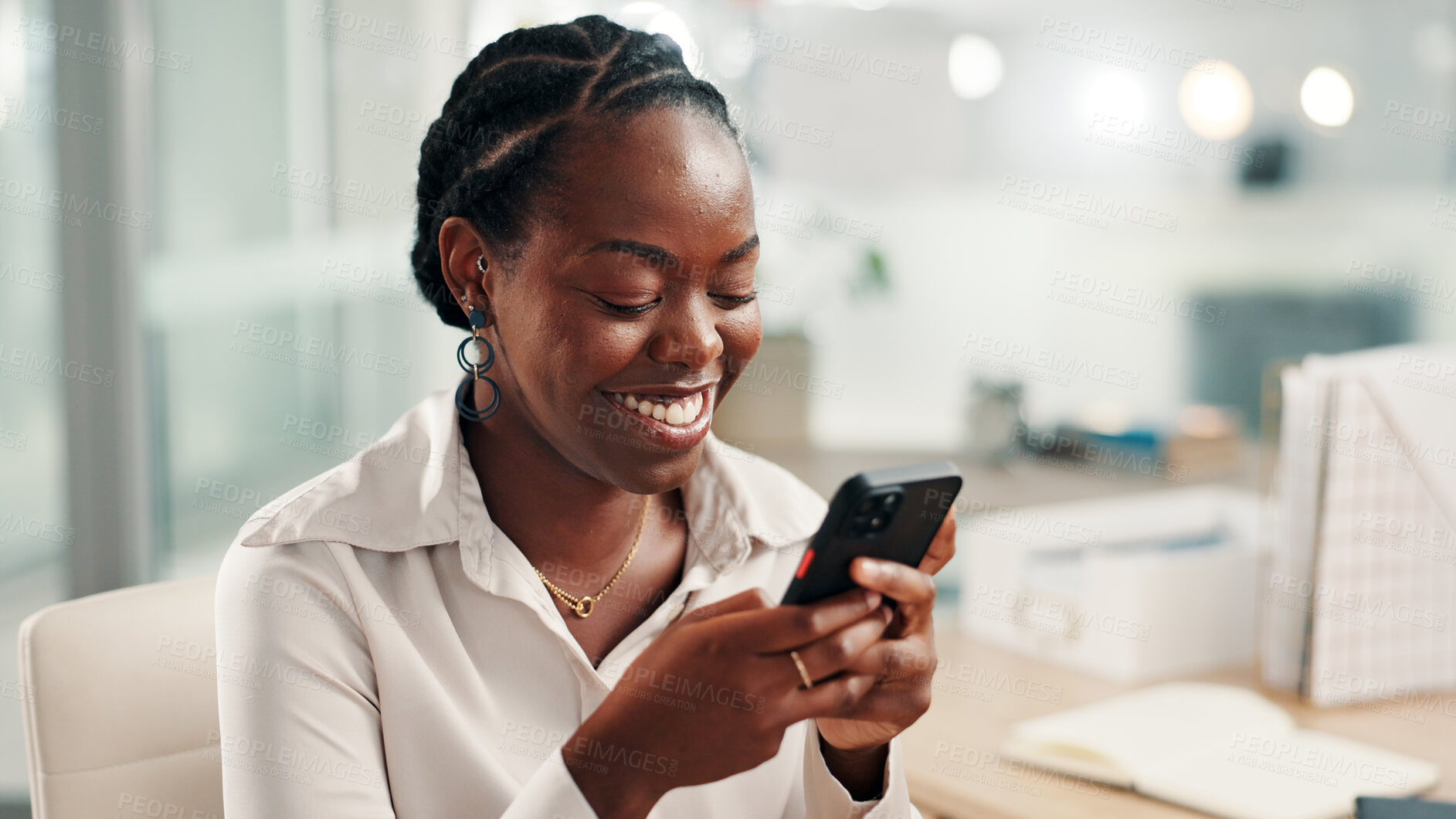 Buy stock photo Smartphone, smile and business woman with texting, social media or message in office laughing at meme. Funny, communication and black person employee browsing website, mobile or internet app on phone