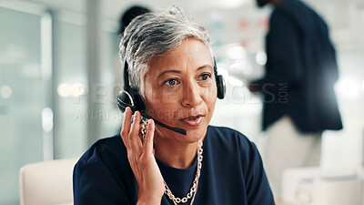 Buy stock photo Mature woman, consultant and talking with headset at call center for online communication. Female person, agent or employee speaking with mic or technology for virtual assistance or help at office