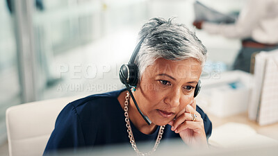 Buy stock photo Thinking, office and mature woman in call center with stress for contact us, crm service or customer support. Business, professional consultant and person with headset for problem solving on computer