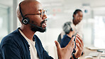 Man, consultant or discussion with headset at call center for customer service or online advice. Male person, agent or employee talking with mic on technology for virtual assistance or help at office