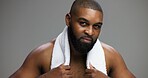 Shower, skincare and portrait of black man in studio for beauty, grooming and dermatology. Cosmetics, glow and self care with person and towel on gray background for hydration, hygiene and shine