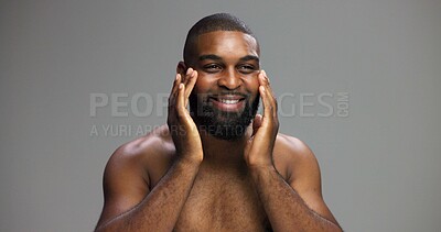 Buy stock photo Smile, skincare and beauty with black man in studio for salon, grooming and dermatology. Cosmetics, glow and self care with person and facial on gray background for hydration, hygiene and shine