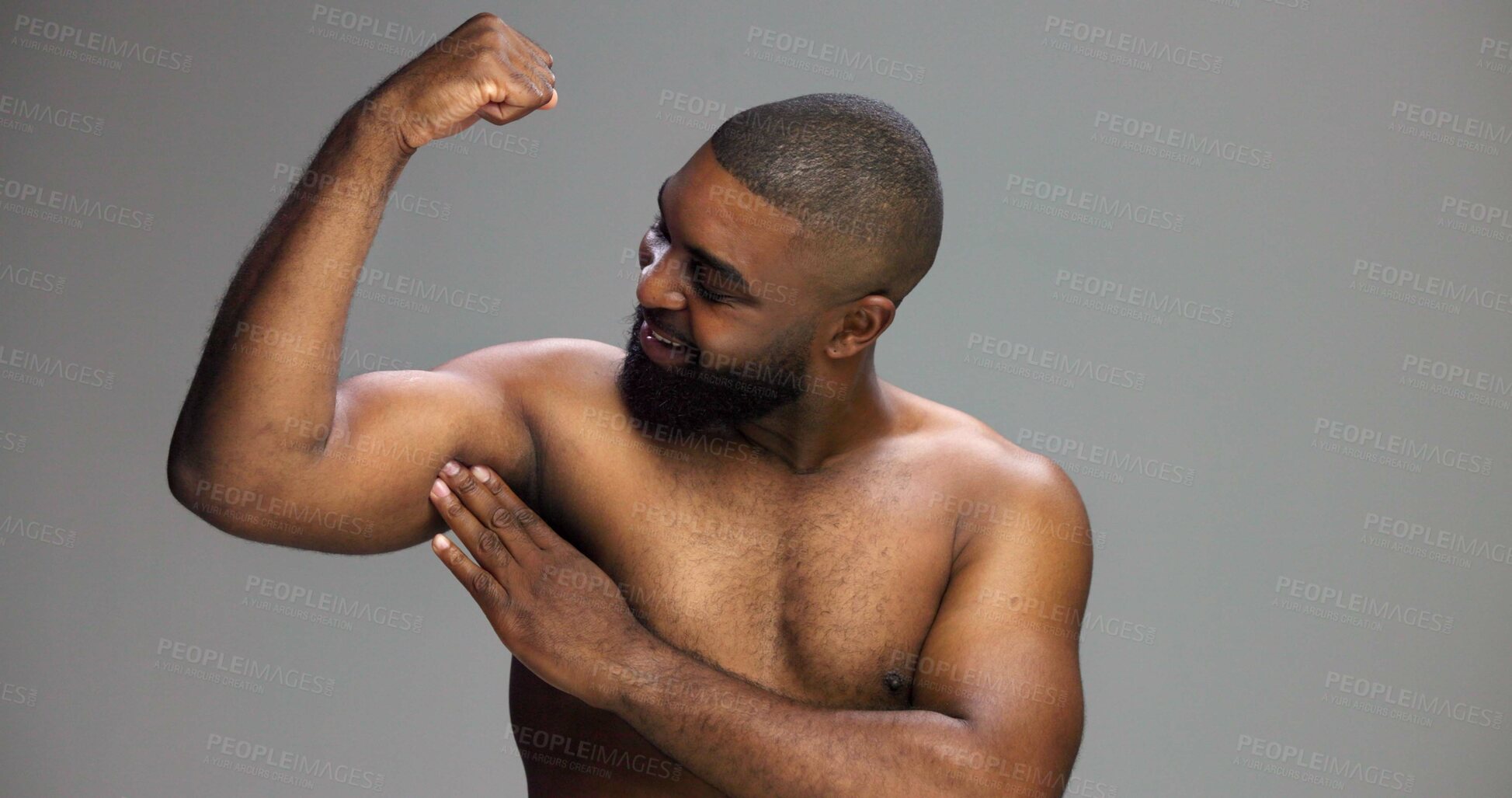 Buy stock photo Bicep, body and smile of shirtless black man in studio for fitness, health or strong muscles. Arm, exercise and power with happy African person isolated on gray background for strength or wellness