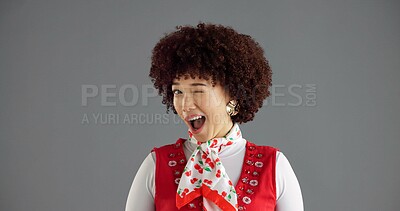 Buy stock photo Happy, wink and portrait of woman in studio with trendy clothes, cool style and retro outfit. Mockup space, fashion and face of person with confidence, emoji gesture and flirting on gray background
