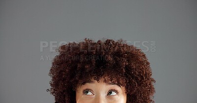Buy stock photo Woman, face and eyes with thinking closeup, ideas or solution with problem solving for brainstorming in studio. Vision, dream or mindset for decision, person with afro and space on gray background