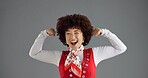 Happy woman, retro or flexing with fashion, power or wink in studio for strength or pride on grey background. Motivation, creative designer or afro girl model with portrait, vintage clothes and space