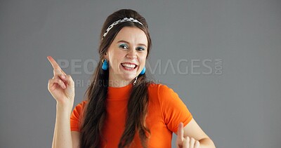 Buy stock photo Happy woman, point and info in studio for advertising dance, announcement or news about us on gray background. Mockup space, portrait or coming soon with energy movement, sign or direction for launch