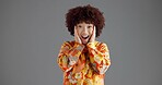 Surprise, happy and portrait of woman in studio with announcement, good news or secret with wow. Mockup space, shock and female person with amazed, excited or OMG face expression by gray background.