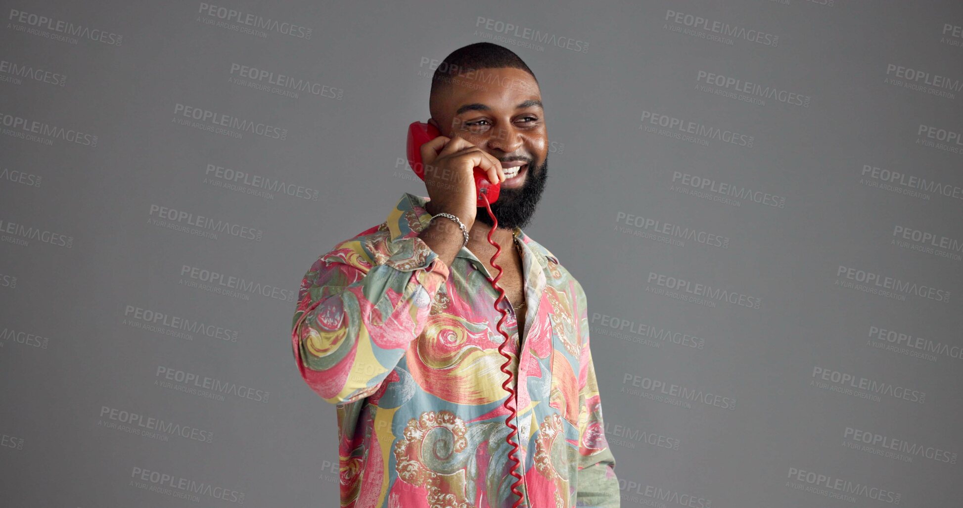 Buy stock photo Telephone, fashion and happy black man in studio with trendy clothes, style and outfit. Vintage, aesthetic and isolated person with phone call for communication, contact and gossip on gray background