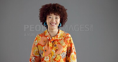 Buy stock photo Woman, retro fashion and portrait in studio with smile, confidence and accessories for aesthetic. Creative, designer and vintage style on gray background space with happiness, floral print and afro