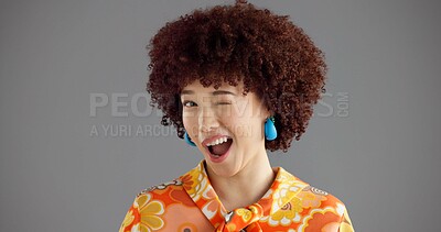 Buy stock photo Woman, wink and portrait in studio with retro style, smile and joke with secret deal on grey background. Girl, person and laughing with eye sign, vintage fashion and playful flirting expression