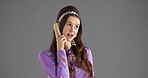 Telephone, fashion and woman in studio talking with trendy clothes, style and outfit. Vintage, aesthetic and isolated person with phone call for communication, contact and gossip on gray background