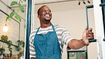 Front door, thinking and smile with black man in cafe for order, hospitality and small business vision. Restaurant, reflection and barista or person in coffee shop for bakery, future and catering
