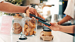 Coffee shop, card machine and customer with phone in cafe for service, help and digital pos. Restaurant, hospitality and person for online transaction, payment and purchase for takeaway drinks