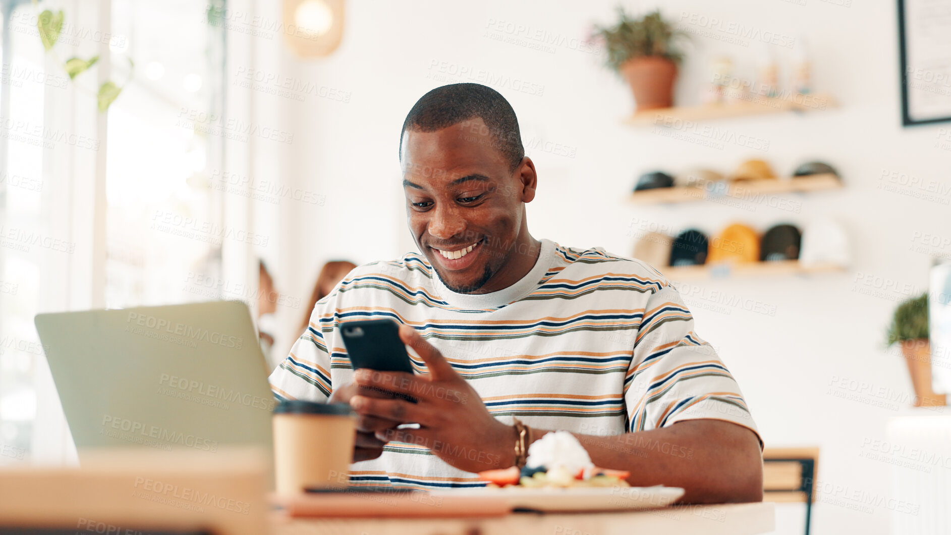 Buy stock photo Coffee shop, remote work and man on laptop and phone for online project, research report or networking, Happy, freelancer and person on smartphone in restaurant for social media, internet and website