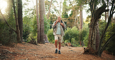 Buy stock photo Hiking, senior man and thinking in forest with walking direction, retirement hobby or cardio adventure. Trekking, mature person and backpack in nature for sightseeing, travel journey or explore woods