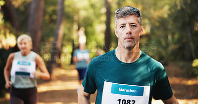 Buy stock photo Marathon, portrait and running with man in forest for challenge, performance or race. Cardio, competition and fitness with mature runner at rally event in nature or woods for course, heat or trial