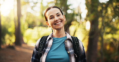 Buy stock photo Portrait, travel and happy woman trekking in woods for holiday and vacation on adventure. Smile, hiking and mature female person in forest for backpacking, tourism and explore nature in Switzerland