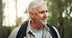 Thinking, hiking and senior man on journey, smile and adventure in nature, outdoor and retirement. Backpacking, travel and elderly person on holiday in woods, trekking and exploration of environment