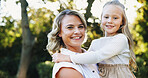 Garden, portrait and smile of mother with daughter outdoor together for bonding, love or safety. Carry, security or trust with single parent woman and girl child in backyard of home for relationship